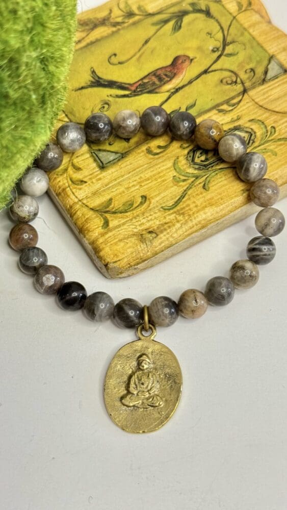 Black Sunstone with Tibetan Charm