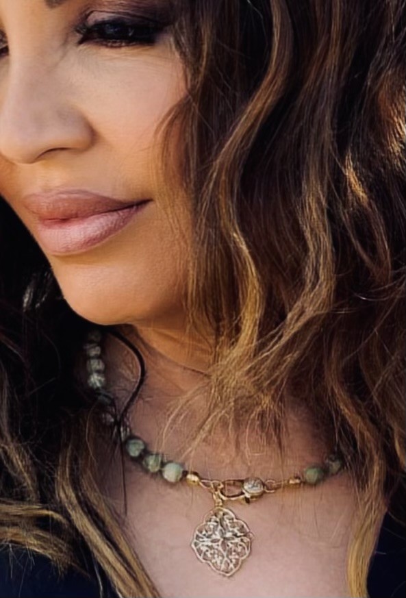 Woman with green necklace